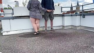 Gorgeous pissing mother-in-law helps son-in-law piss on the top of the parking lot