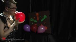 Nicky as a superhero destroys balloons