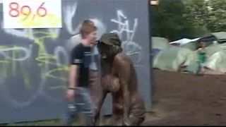 Topless Danish girl covered in mud at Roskilde Festival