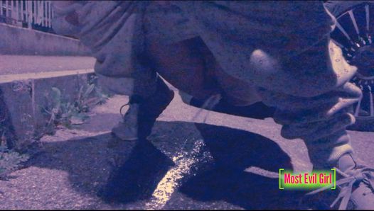 Girl alone at night in a parking lot lowers her pants in public to piss