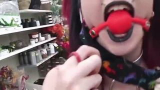 Goth girl gagged in public