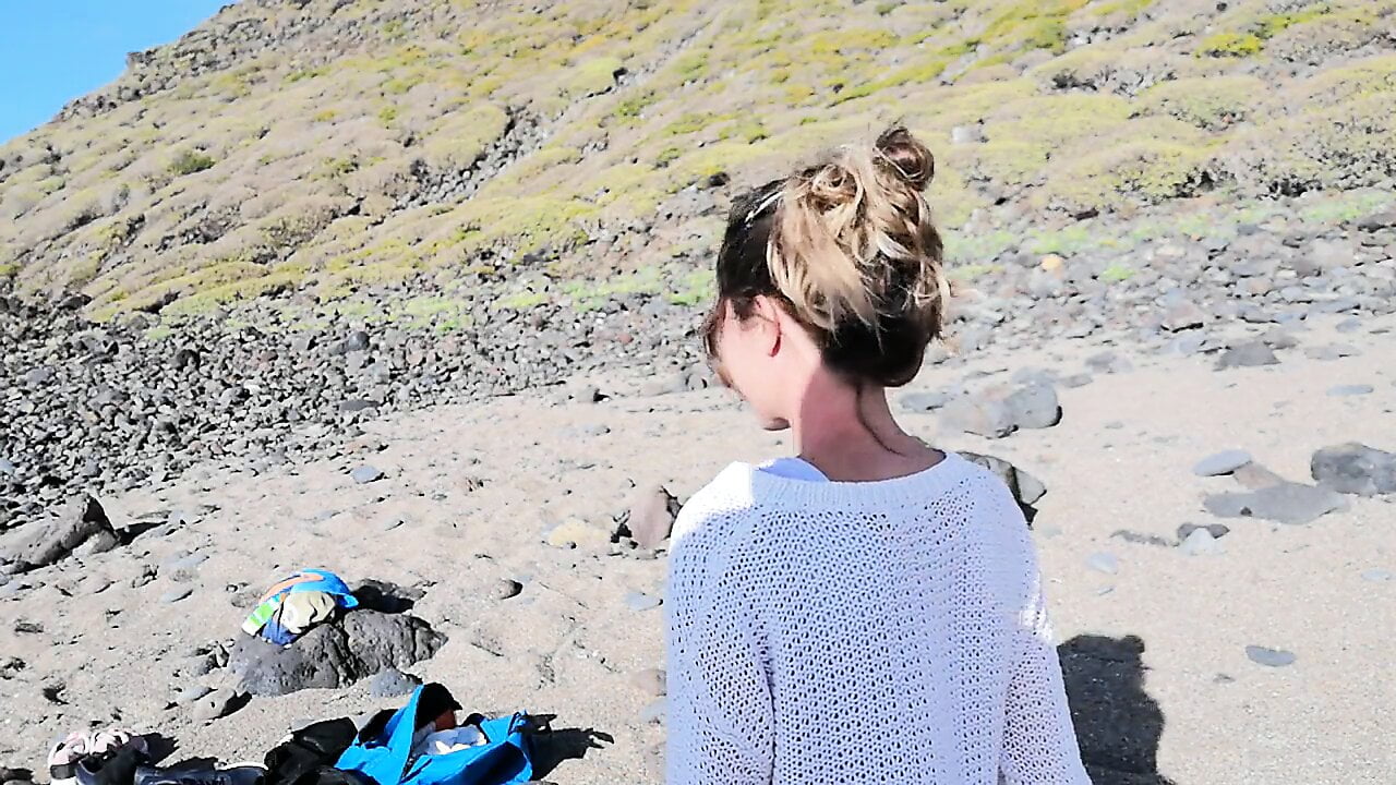 A strange blonde girl gives me a blowjob on the beach