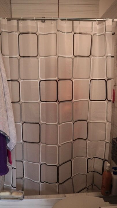 Horny girl danced while she undressed behind the shower curtain